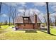 Spacious backyard with mature trees, patio, and well-maintained lawn at 8327 S County Road 825 E, Plainfield, IN 46168