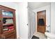 Clean bathroom with shower/tub, wooden cabinet and linen storage at 8327 S County Road 825 E, Plainfield, IN 46168