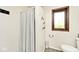 Bathroom with a shower, new toilet, and good light from the window at 8327 S County Road 825 E, Plainfield, IN 46168