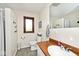 Bathroom featuring wood trim, new toilet, sink and faucet, and ample natural light at 8327 S County Road 825 E, Plainfield, IN 46168