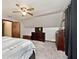Cozy bedroom features neutral carpet, ceiling fan, and dresser at 8327 S County Road 825 E, Plainfield, IN 46168