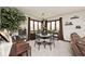 Dining room featuring large windows, neutral carpet, and a round table perfect for entertaining guests at 8327 S County Road 825 E, Plainfield, IN 46168