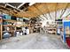 Spacious garage offering ample storage with shelves and work area at 8327 S County Road 825 E, Plainfield, IN 46168