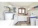 Laundry room with newer appliances and cabinet space for storage of cleaning supplies at 8327 S County Road 825 E, Plainfield, IN 46168