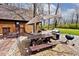 View of the patio with an umbrella, picnic table, and BBQ grill at 8327 S County Road 825 E, Plainfield, IN 46168