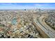 An aerial view of a neighborhood featuring the home's location near a major highway and downtown skyline at 840 Cottage Ave, Indianapolis, IN 46203