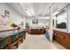 Basement area showing dining table and chairs set beneath industrial lighting and a white ceiling at 840 Cottage Ave, Indianapolis, IN 46203