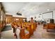 Spacious church interior featuring traditional wooden pews and a high ceiling with multiple ceiling fans at 840 Cottage Ave, Indianapolis, IN 46203