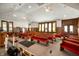 Interior church view showcasing stained glass windows and symmetrical rows of seating for congregants at 840 Cottage Ave, Indianapolis, IN 46203
