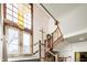 Entryway with exit sign, staircase, and a cross hanging on the wall at 840 Cottage Ave, Indianapolis, IN 46203