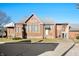 Brick building with gray roof, cross, and statue, set on a sunny street at 840 Cottage Ave, Indianapolis, IN 46203