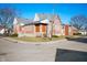 Brick building with a light gray roof, manicured bushes, on a corner lot at 840 Cottage Ave, Indianapolis, IN 46203