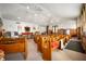 Spacious interior with wooden pews, ceiling fans, and stained glass windows at 840 Cottage Ave, Indianapolis, IN 46203