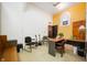 Office space featuring a desk, seating, natural light, and a welcoming atmosphere at 840 Cottage Ave, Indianapolis, IN 46203