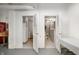 Clean restrooms with toilet stalls, a soda machine, and white-painted brick walls at 840 Cottage Ave, Indianapolis, IN 46203