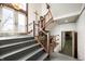 Interior view of the gray staircase, railing and doors with the exit sign visible at 840 Cottage Ave, Indianapolis, IN 46203
