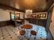 Indoor bar area boasting classic booth seating, dark wood finishes, decorative lighting, and eye-catching tile flooring at 8801 Ridge Hill Dr, Indianapolis, IN 46217