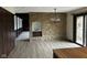 Dining Room with stone accent wall, tile flooring and stylish chandelier at 8801 Ridge Hill Dr, Indianapolis, IN 46217