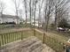 Beautiful backyard with a wooden deck and mature trees providing privacy at 8859 Delaney Dr, Fishers, IN 46038