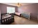 Comfortable bedroom with ceiling fan and two twin sized beds and neutral carpet at 8859 Delaney Dr, Fishers, IN 46038