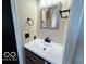A modern bathroom vanity and fixtures at 9218 Wind River Ct, Indianapolis, IN 46234