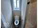 Bathroom features a modern toilet, shower and natural light at 9218 Wind River Ct, Indianapolis, IN 46234