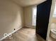Bathroom featuring toilet, new flooring and a window at 9218 Wind River Ct, Indianapolis, IN 46234