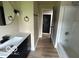 Bathroom with a modern vanity, sleek fixtures, and updated lighting at 9218 Wind River Ct, Indianapolis, IN 46234