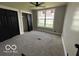Bedroom with large windows, new carpet, and ample closet space at 9218 Wind River Ct, Indianapolis, IN 46234