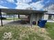 View of the property's carport, showing ample space for parking and storage at 9218 Wind River Ct, Indianapolis, IN 46234