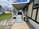 Covered porch featuring stairs leading to a cozy home at 9218 Wind River Ct, Indianapolis, IN 46234