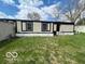 View of the home's exterior, highlighting the well-maintained lawn and tidy appearance at 9218 Wind River Ct, Indianapolis, IN 46234