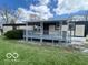 A charming home featuring a covered porch great for relaxing at 9218 Wind River Ct, Indianapolis, IN 46234