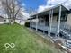 Cozy home featuring a covered deck, providing a perfect spot for outdoor relaxation at 9218 Wind River Ct, Indianapolis, IN 46234