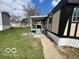Exterior view of the home with covered deck perfect for outdoor entertaining at 9218 Wind River Ct, Indianapolis, IN 46234