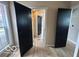 Interior shot showcasing black doors and new wood laminate flooring at 9218 Wind River Ct, Indianapolis, IN 46234