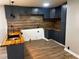 Modern kitchen featuring stainless steel appliances and butcher block countertops at 9218 Wind River Ct, Indianapolis, IN 46234