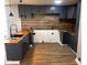 Modern kitchen featuring stainless steel appliances and butcher block countertops at 9218 Wind River Ct, Indianapolis, IN 46234
