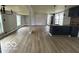 Large living room featuring kitchen area, new flooring, and great natural light at 9218 Wind River Ct, Indianapolis, IN 46234