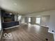 Spacious open-concept living room featuring new flooring and recessed lighting at 9218 Wind River Ct, Indianapolis, IN 46234
