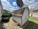 A small shed provides extra storage space for tools and outdoor equipment at 9218 Wind River Ct, Indianapolis, IN 46234