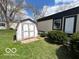 A weathered shed provides extra storage space next to the house at 9218 Wind River Ct, Indianapolis, IN 46234