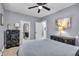 Comfortable bedroom features nice dressers, carpeted floor, ceiling fan, and neutral paint at 936 N Oxford St, Indianapolis, IN 46201