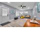 Bright living room with stylish flooring, ceiling fan, and plenty of natural light at 936 N Oxford St, Indianapolis, IN 46201