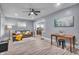 Cozy living room featuring modern paint, a ceiling fan and a comfortable sofa at 936 N Oxford St, Indianapolis, IN 46201