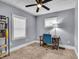 Cozy home office features carpeted floors, a desk, and shelving at 936 N Oxford St, Indianapolis, IN 46201