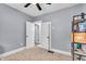 A view of a room with neutral walls and carpeted floor, with two doors at 936 N Oxford St, Indianapolis, IN 46201