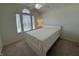 Bright bedroom featuring a large window, neutral carpet, and a simple decor at 10404 Trillium Ct, Noblesville, IN 46060
