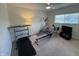 Carpeted exercise room with an elliptical, rower, treadmill, and TV at 10404 Trillium Ct, Noblesville, IN 46060