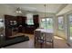 Well-lit kitchen with wooden cabinets, stainless steel appliances and breakfast table at 10404 Trillium Ct, Noblesville, IN 46060